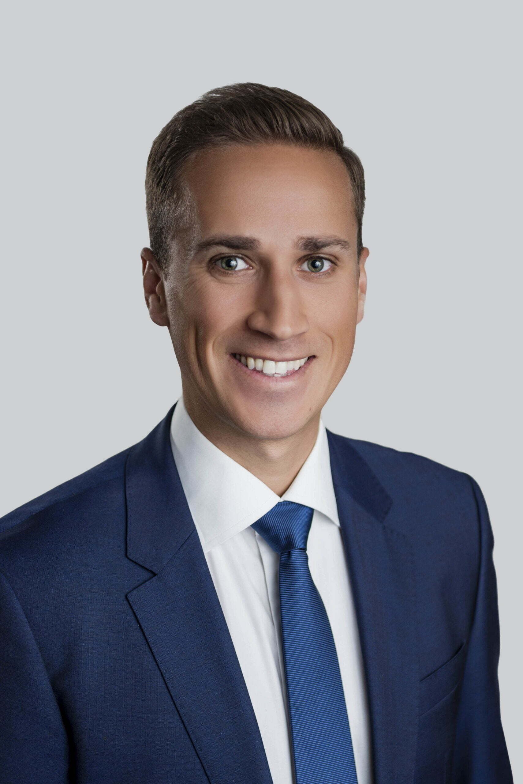 BC Liberals-10- Smiling man in blue suit and tie