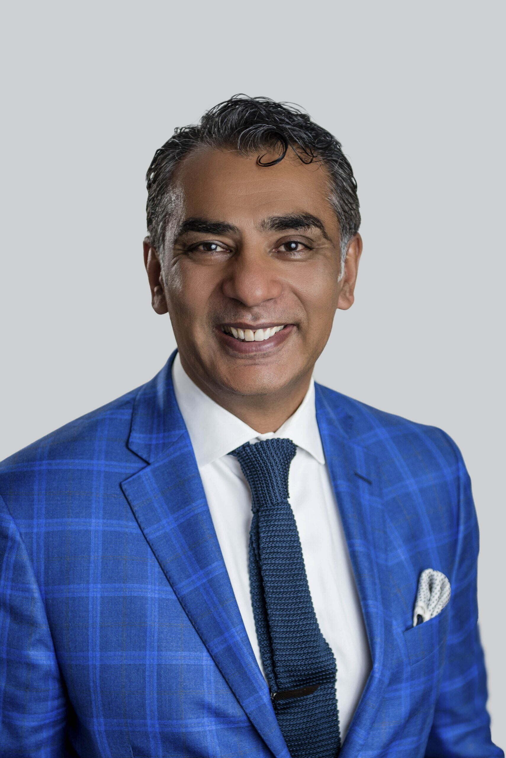 BC Liberals-12- Smiling man in blue suit and tie