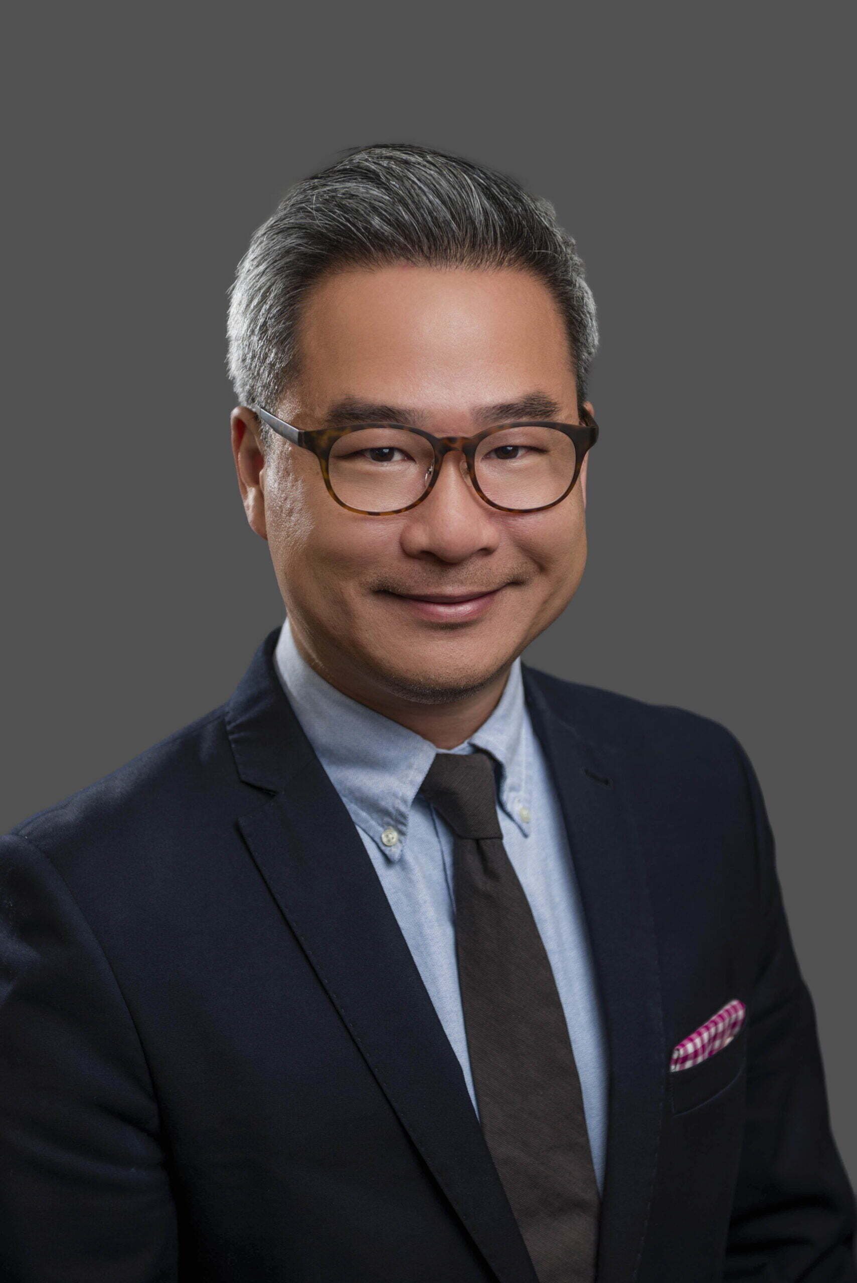 BC Liberals-15- Smiling man in suit and glasses bc liberals