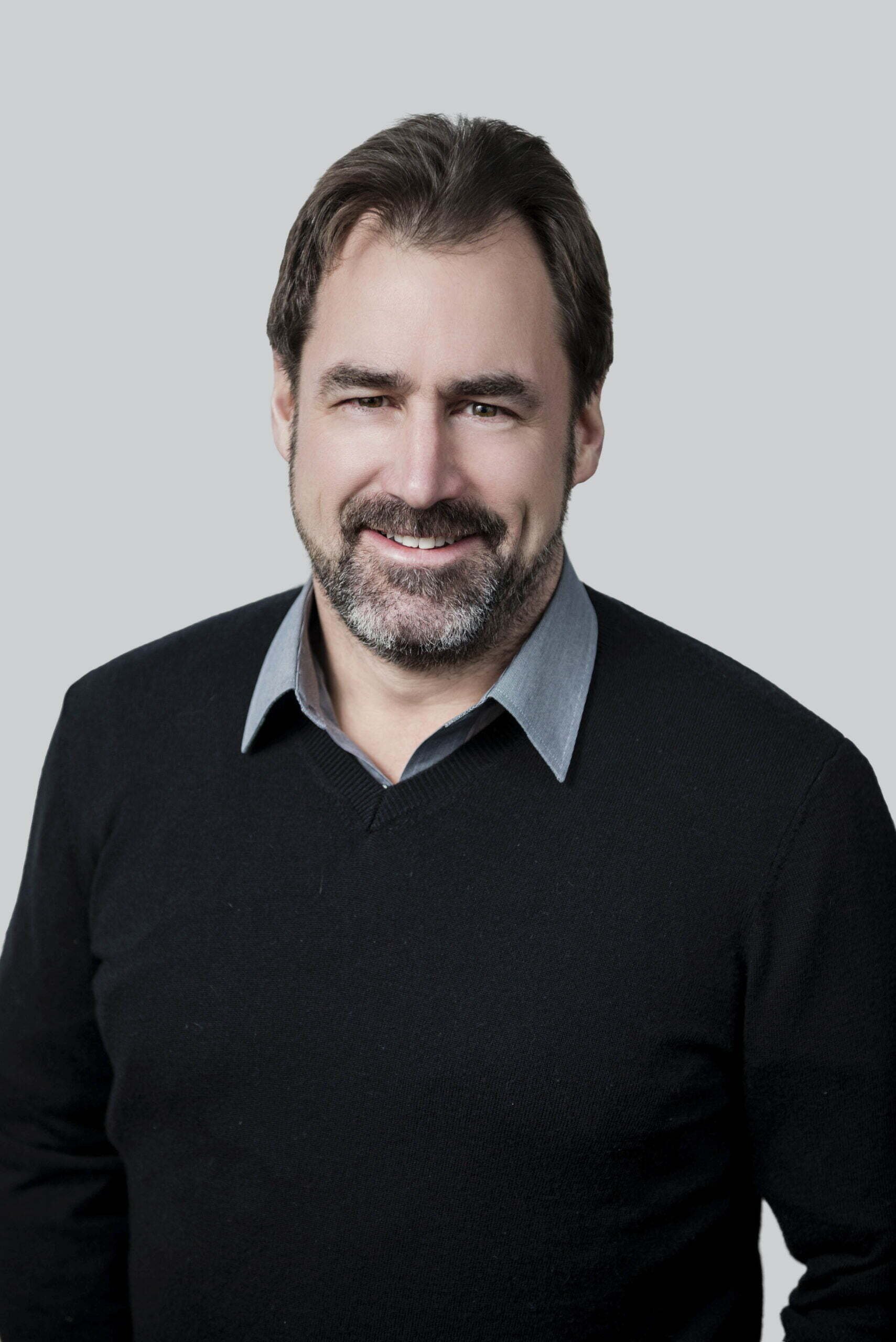 BC Liberals-3- Smiling man in sweater Whistler MLA