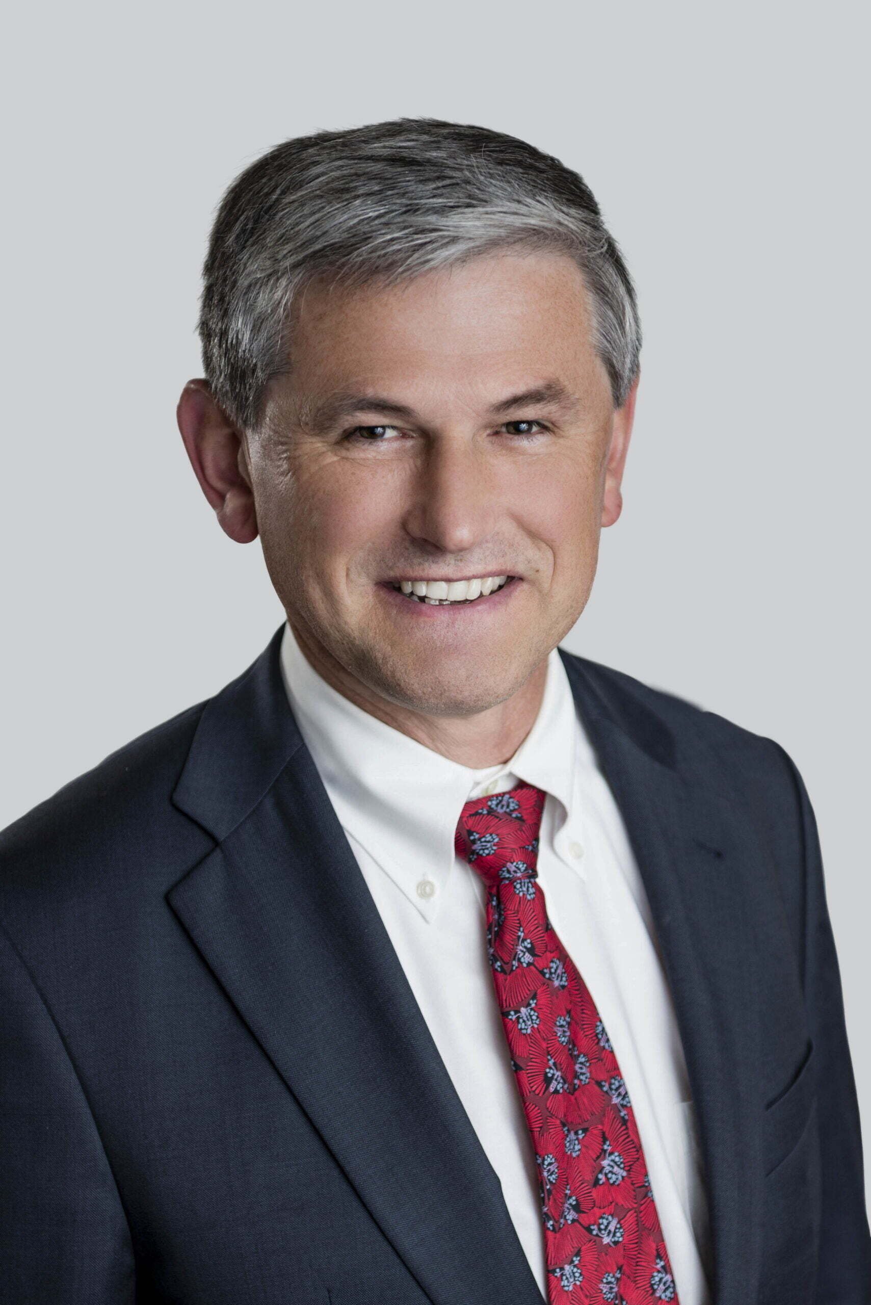 BC Liberals-9- Man in suit with red tie smiling