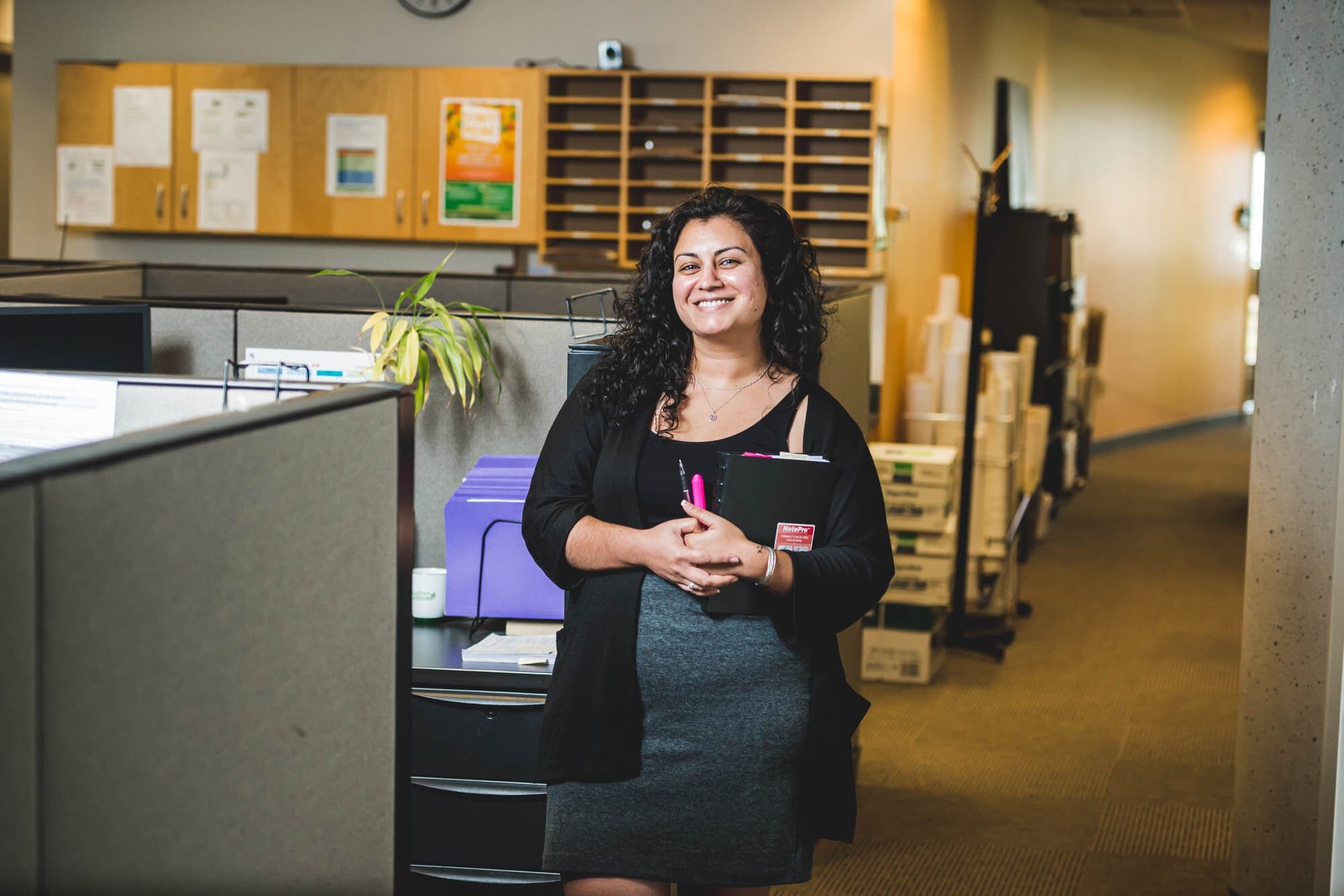 CoquitlamCityHR-13 Smiling woman standing in office environment