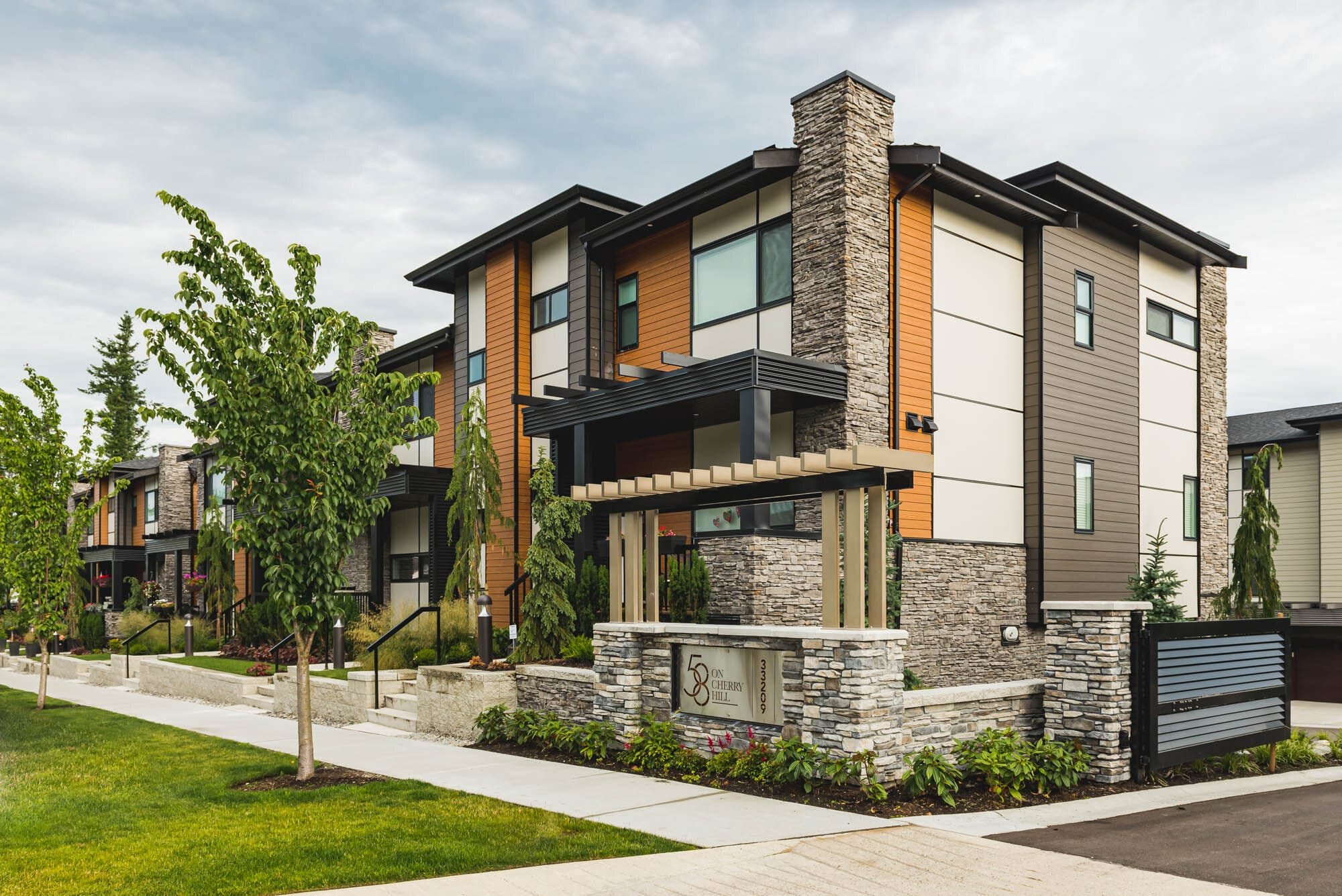 Cronus Masonry-1 Modern apartment complex with stone facade