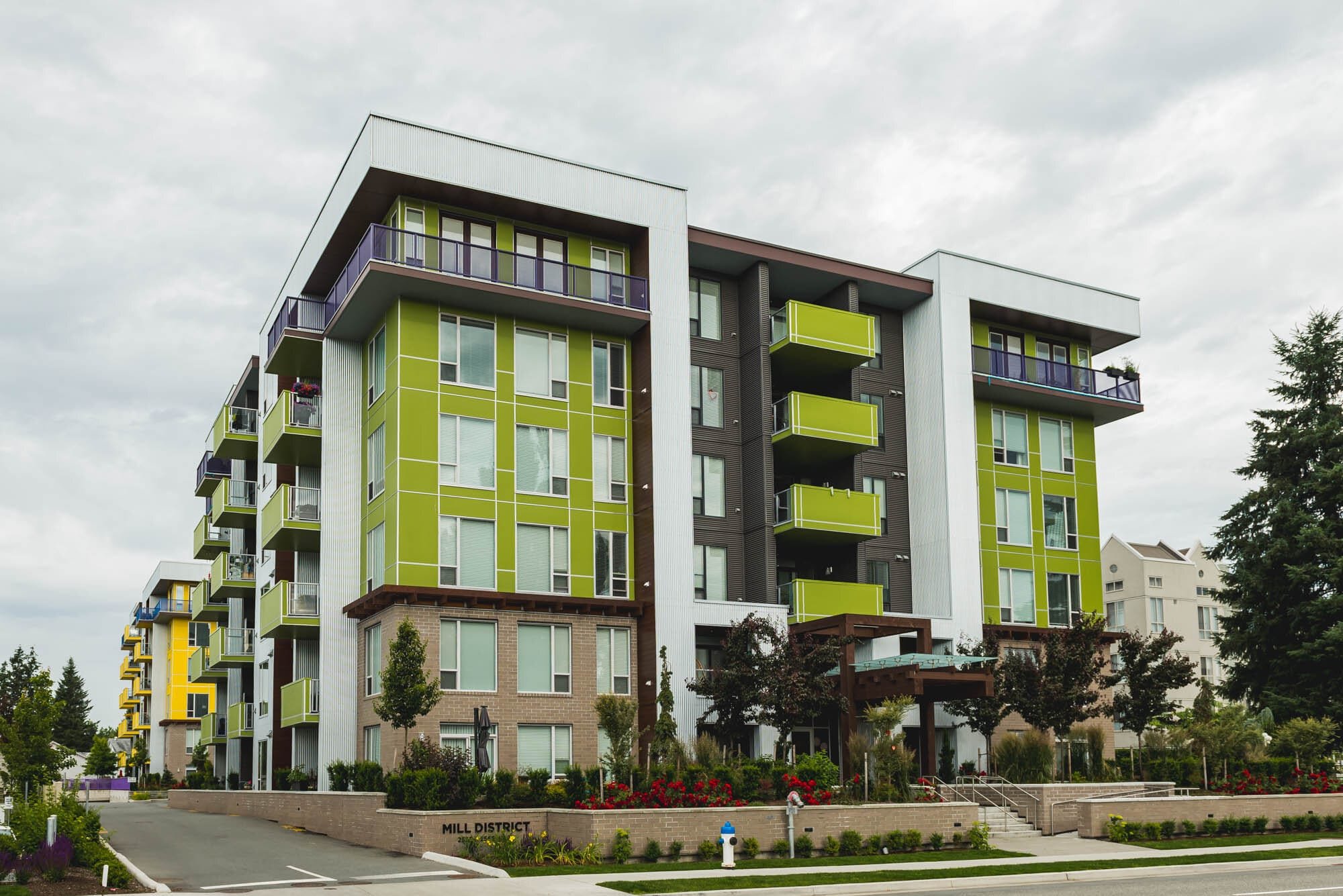 Cronus Masonry-2 Modern green and yellow apartment building