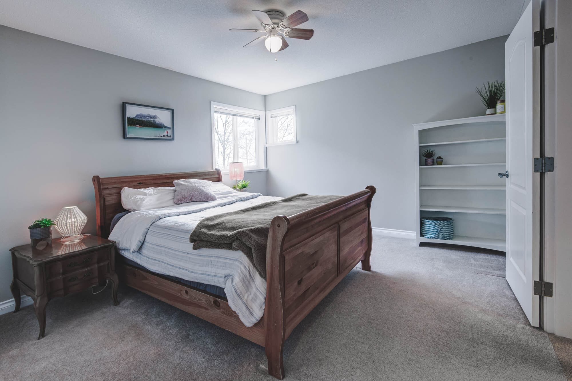 Cozy bedroom with wooden bed and nightstand