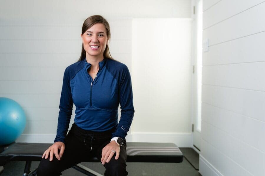 Smiling woman sitting in a gym