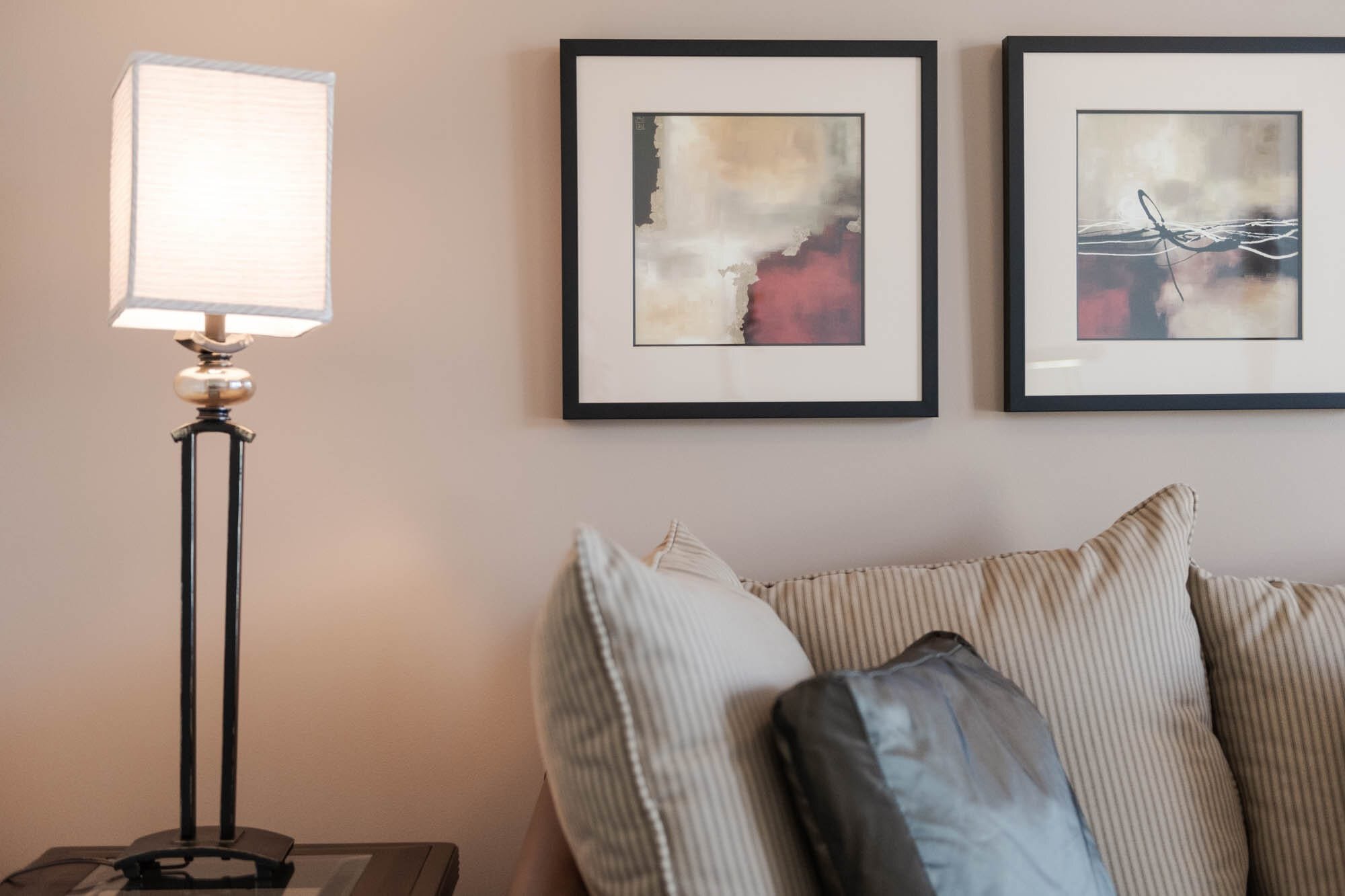 Coal Harbour Penthouse-5 Modern living room with lamp and abstract art.