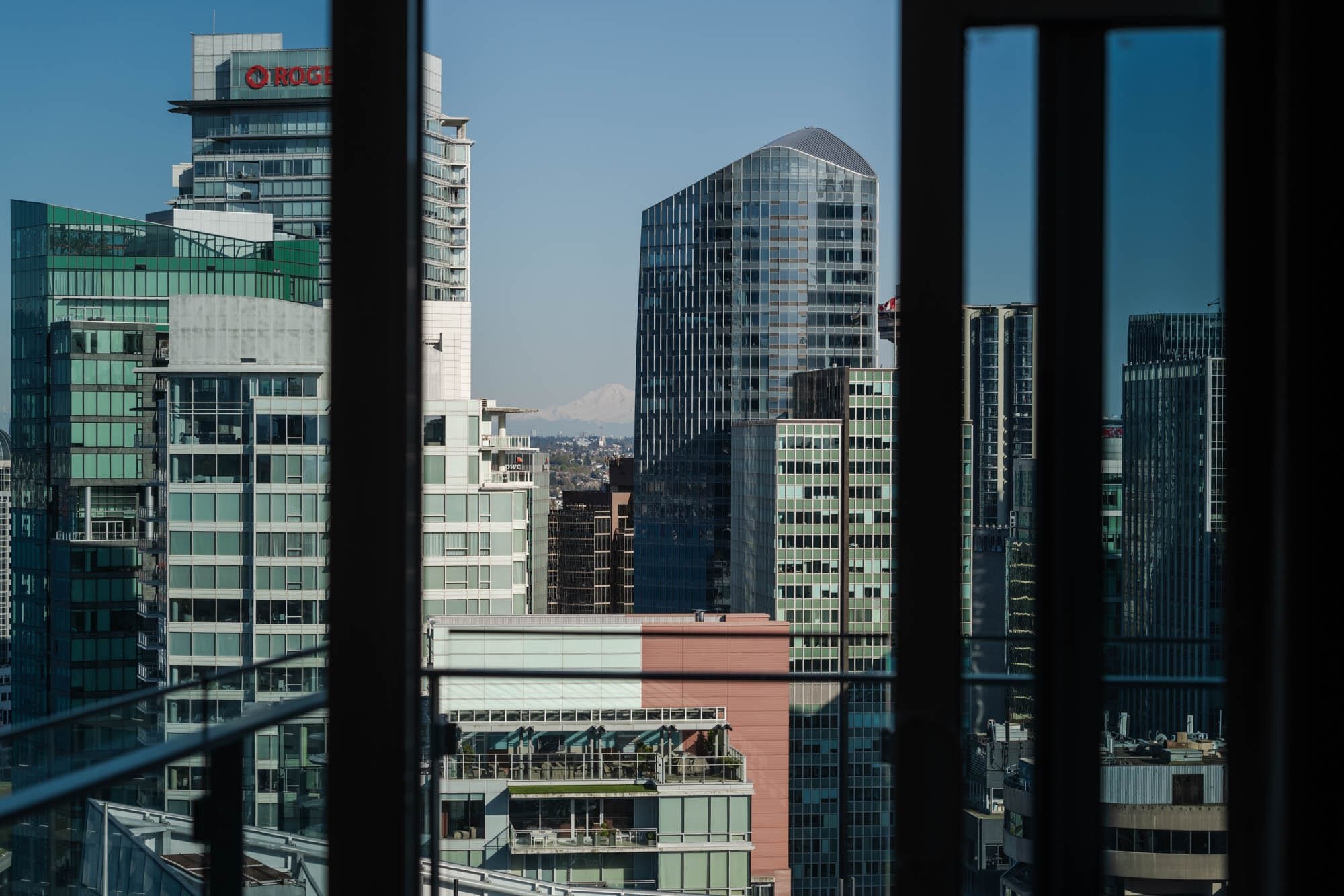Coal Harbour Penthouse-6 City buildings through window frame
