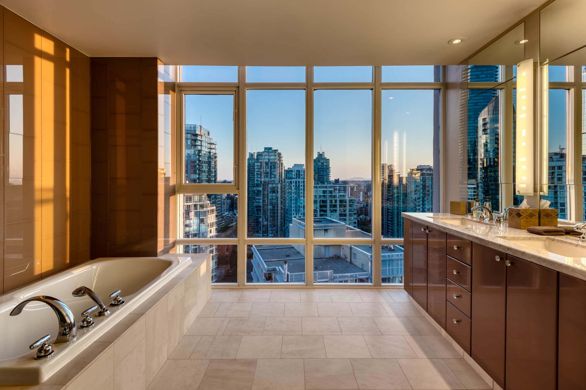 Coal Harbour Penthouse-7 Modern bathroom with sunset city skyline view