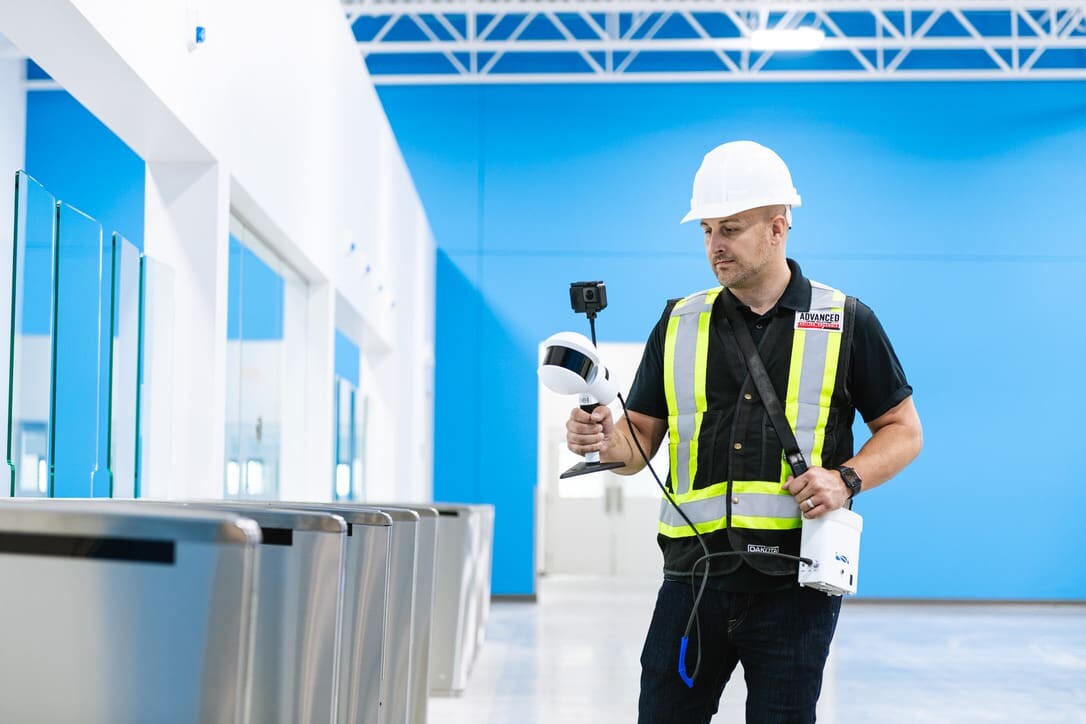 Construction worker using Lidar camera equipment by Greenvalley