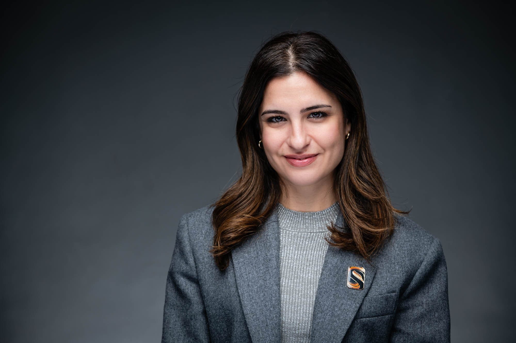 GeaCongress Headshots-30 Smiling woman in gray blazer portrait