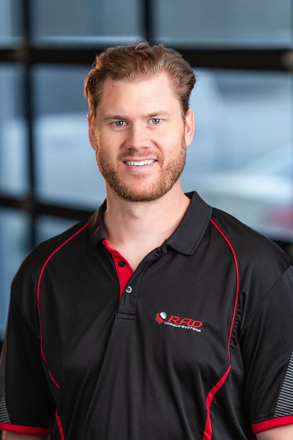 Rad Torque Web-3 Man in RAD Torque Systems shirt smiling