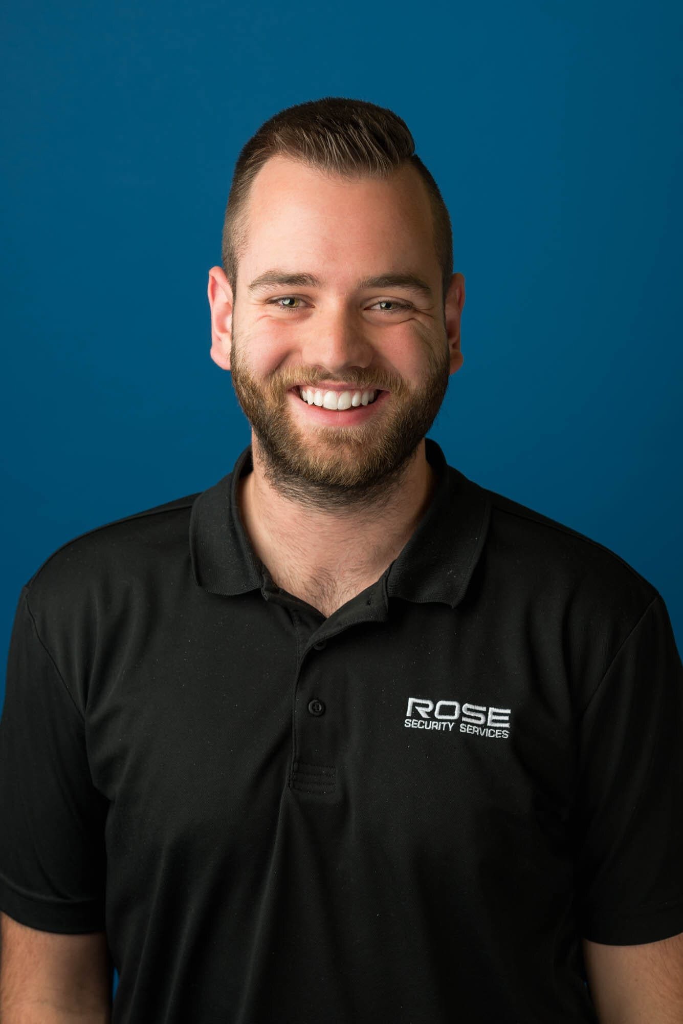 Rose Security Headshots-9 Smiling staff member in Rose Security Services uniform
