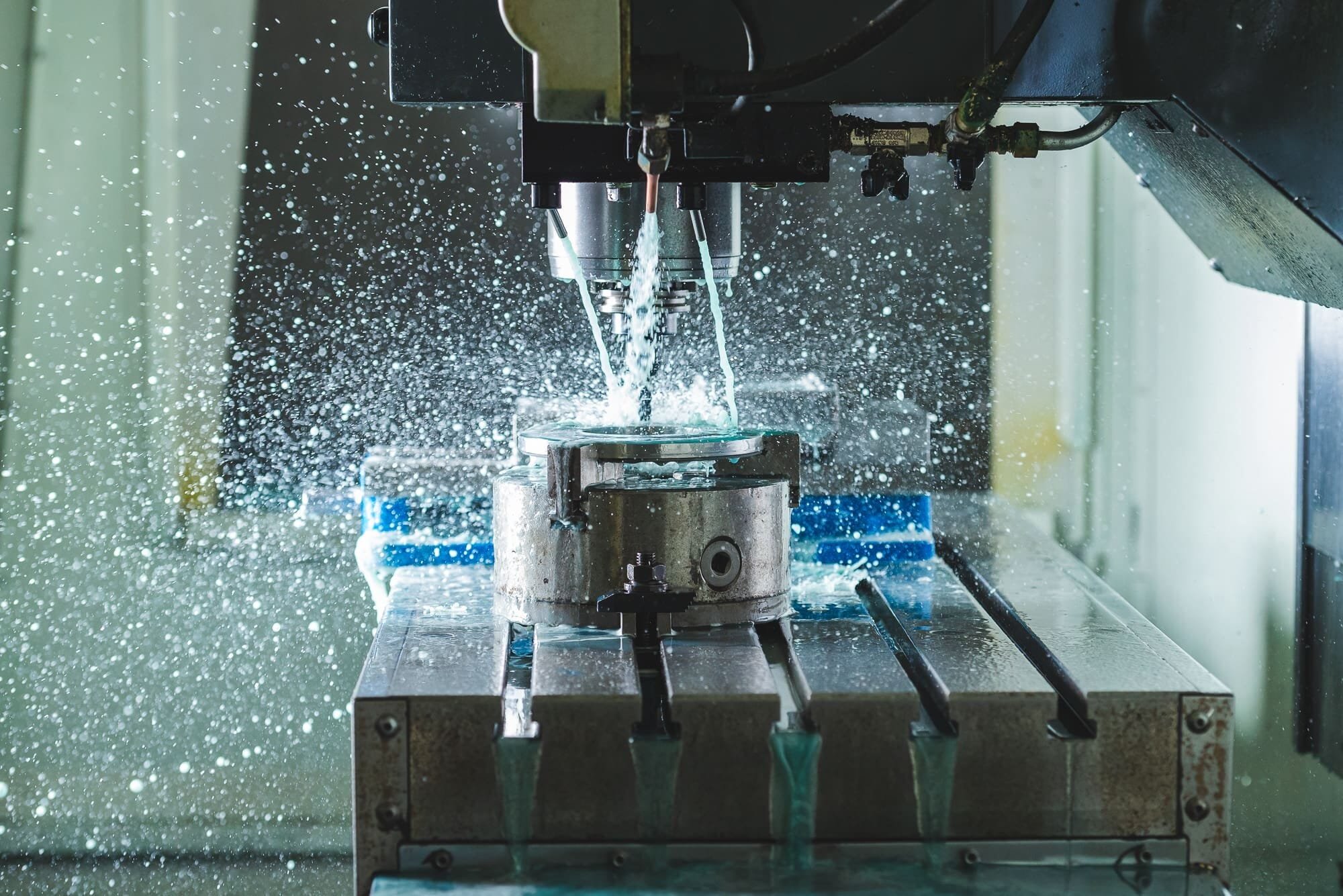 BAP_2618 CNC machine cutting metal with coolant spray