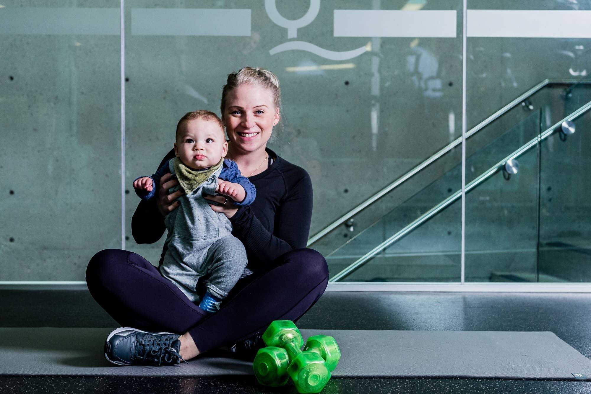 BAP_8907 Mother with baby exercising at gym