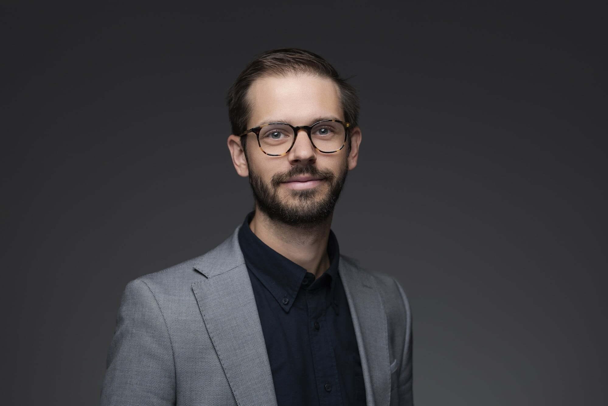 Balderston_Joseph_427-0100--retouched Man in suit and glasses portrait